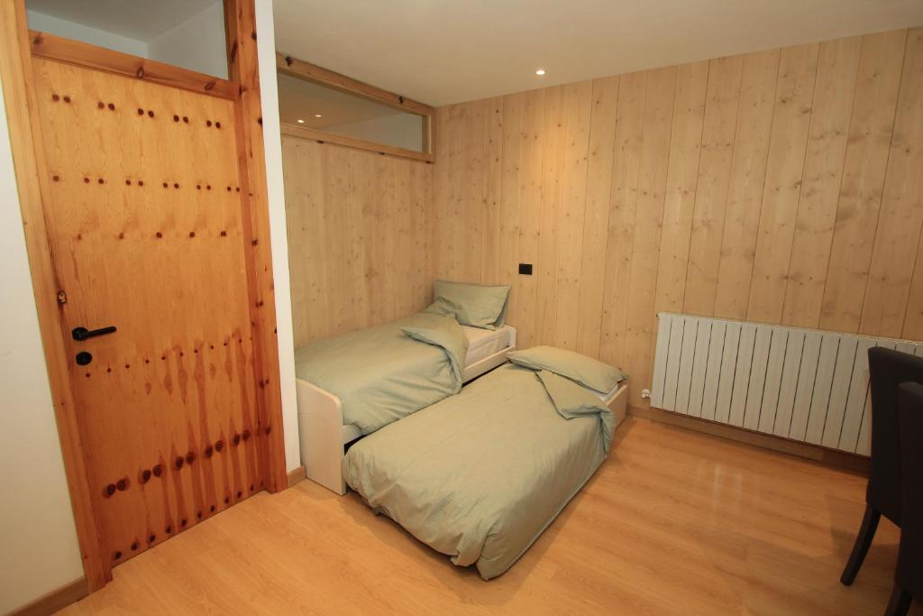 Posteľ alebo postele v izbe v ubytovaní Anemone Home
