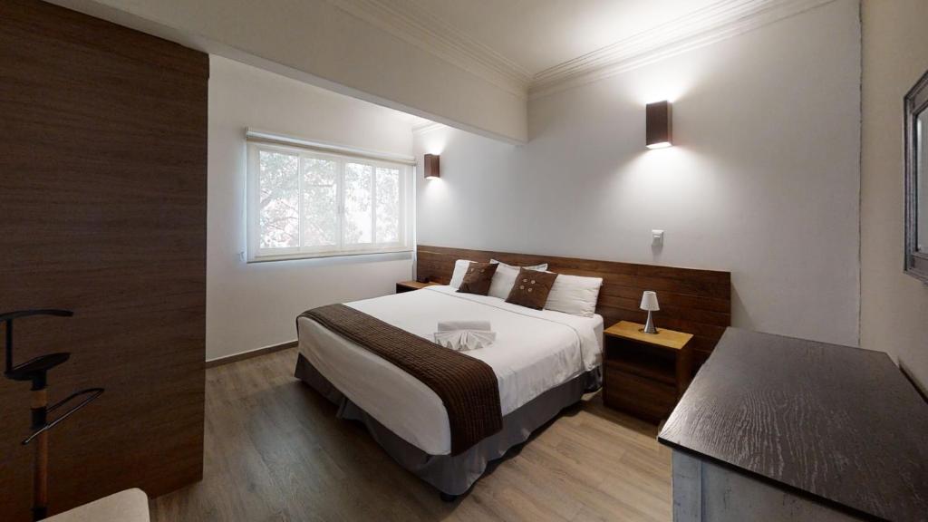 Ліжко або ліжка в номері Tokio Suites
