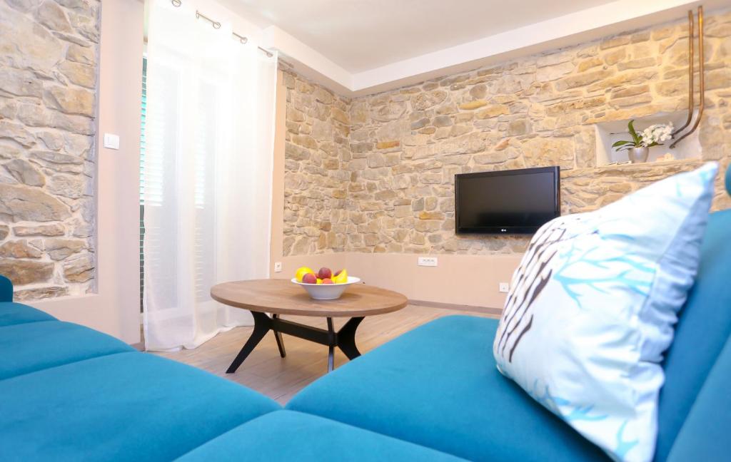 Televízia a/alebo spoločenská miestnosť v ubytovaní Apartment Dvor