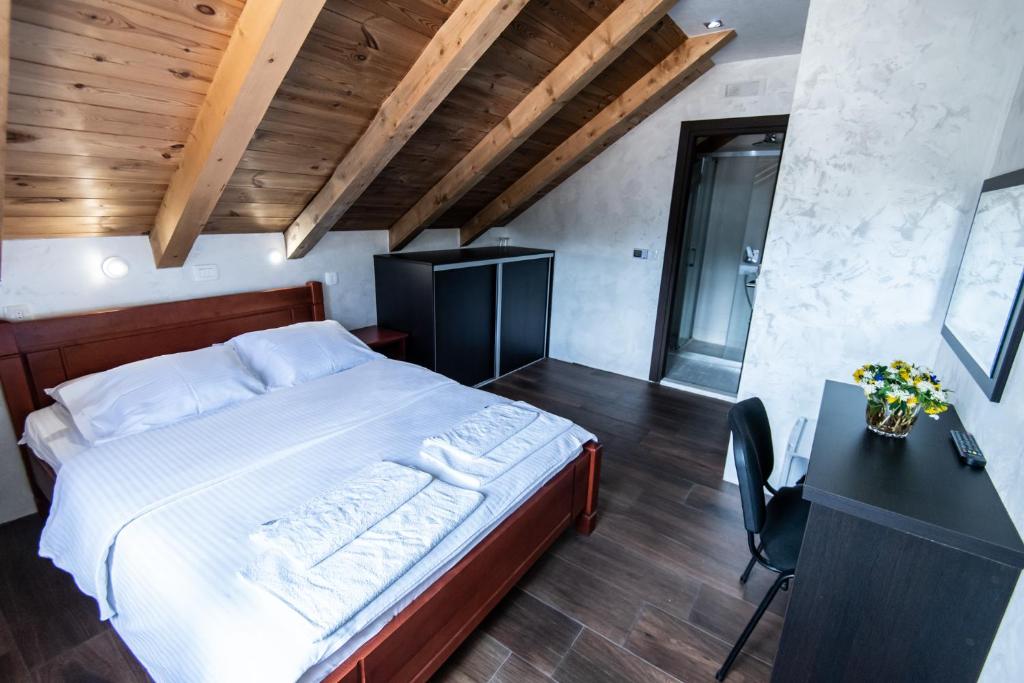 Postel nebo postele na pokoji v ubytování Hotel Enigma