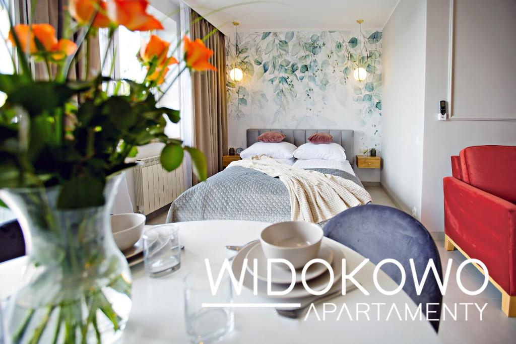 Posteľ alebo postele v izbe v ubytovaní WIDOKOWO Apartamenty