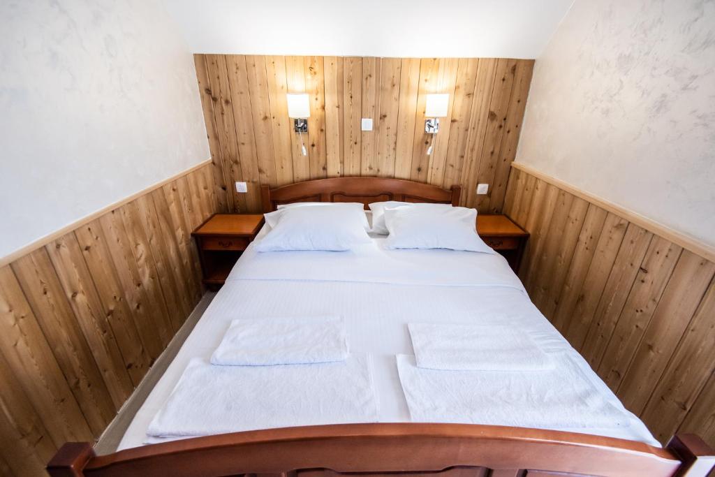Postel nebo postele na pokoji v ubytování Hotel Enigma