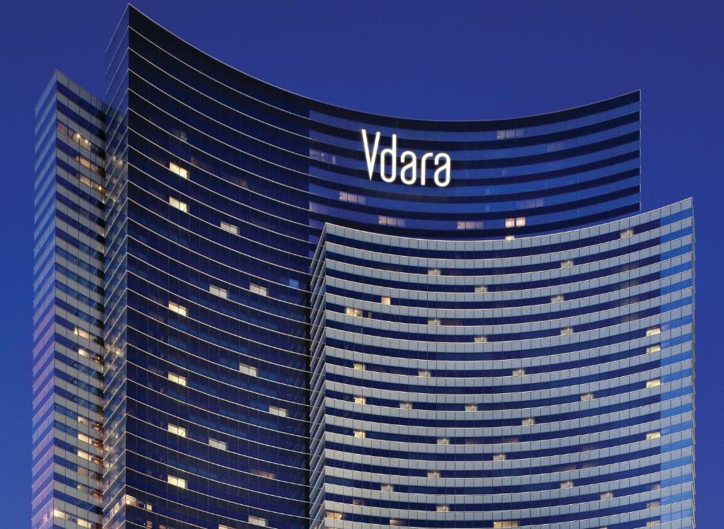 a tall building with the vida logo on it at Vdara Hotel & Spa at ARIA Las Vegas in Las Vegas