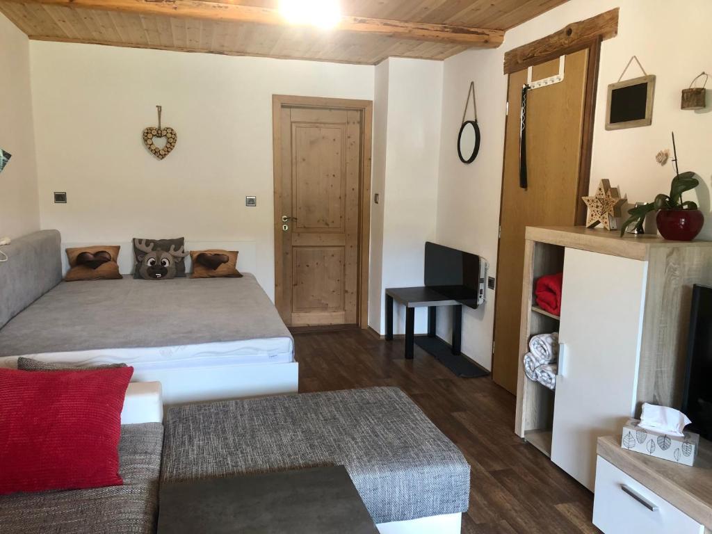 Postel nebo postele na pokoji v ubytování Apartmán s výhledem na Jezerní stěnu
