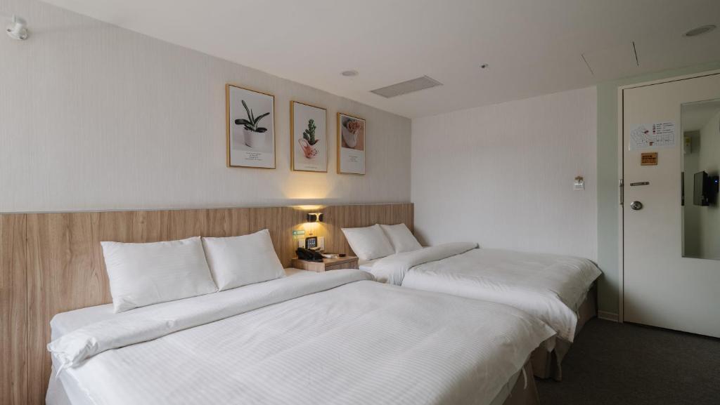 Postel nebo postele na pokoji v ubytování Hotel attic