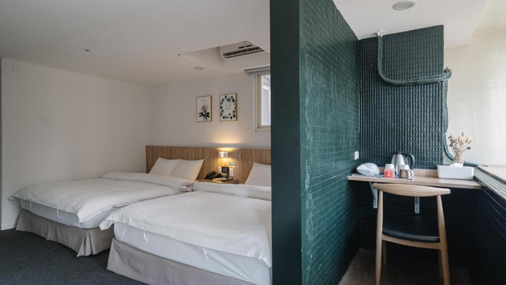 Postel nebo postele na pokoji v ubytování Hotel attic