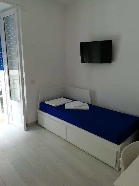 Łóżko lub łóżka w pokoju w obiekcie Blue Moon Apartments