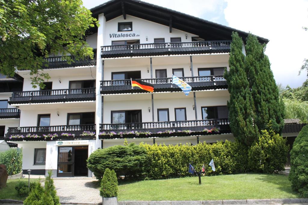 a large white building with trees in front of it at Vitalesca in Neuschönau