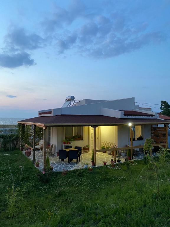 a house with a roof that has a patio at Samothraki - sea, mountain, quiet in Samothráki
