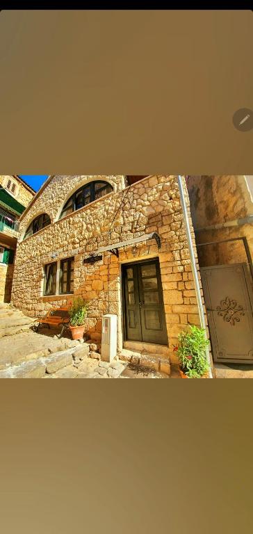 a stone building with a door and a window at Villa Eximia Novigrad in Novigrad Dalmatia