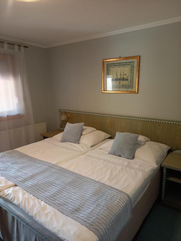 Postel nebo postele na pokoji v ubytování Mézesvölgy Vendégház