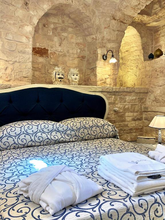 Łóżko lub łóżka w pokoju w obiekcie Trulli e Puglia Luxury Suite