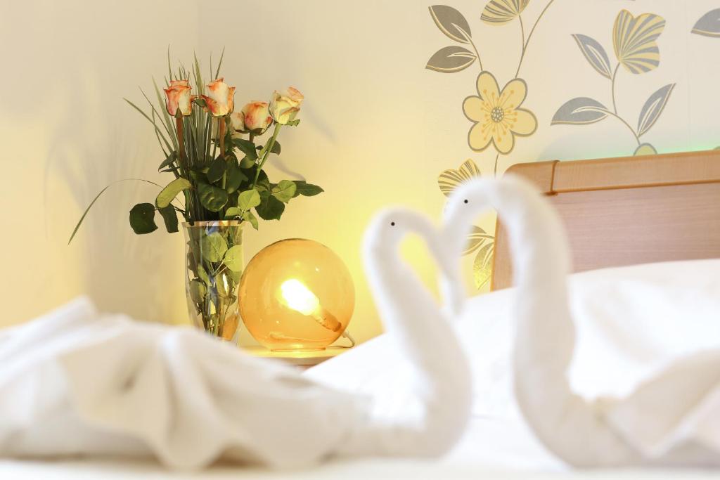 Postel nebo postele na pokoji v ubytování Sunrise Apartments 3