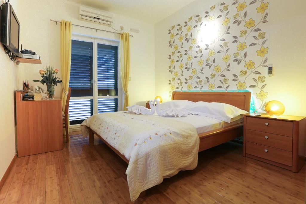 Postel nebo postele na pokoji v ubytování Sunrise Apartments 3