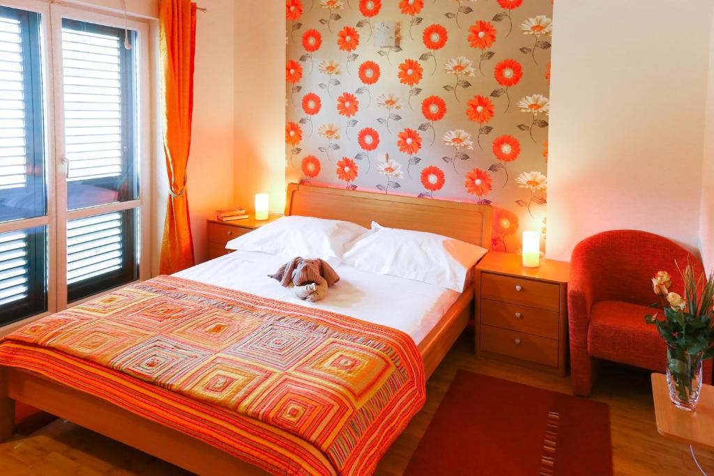Postel nebo postele na pokoji v ubytování Sunrise Apartments 3