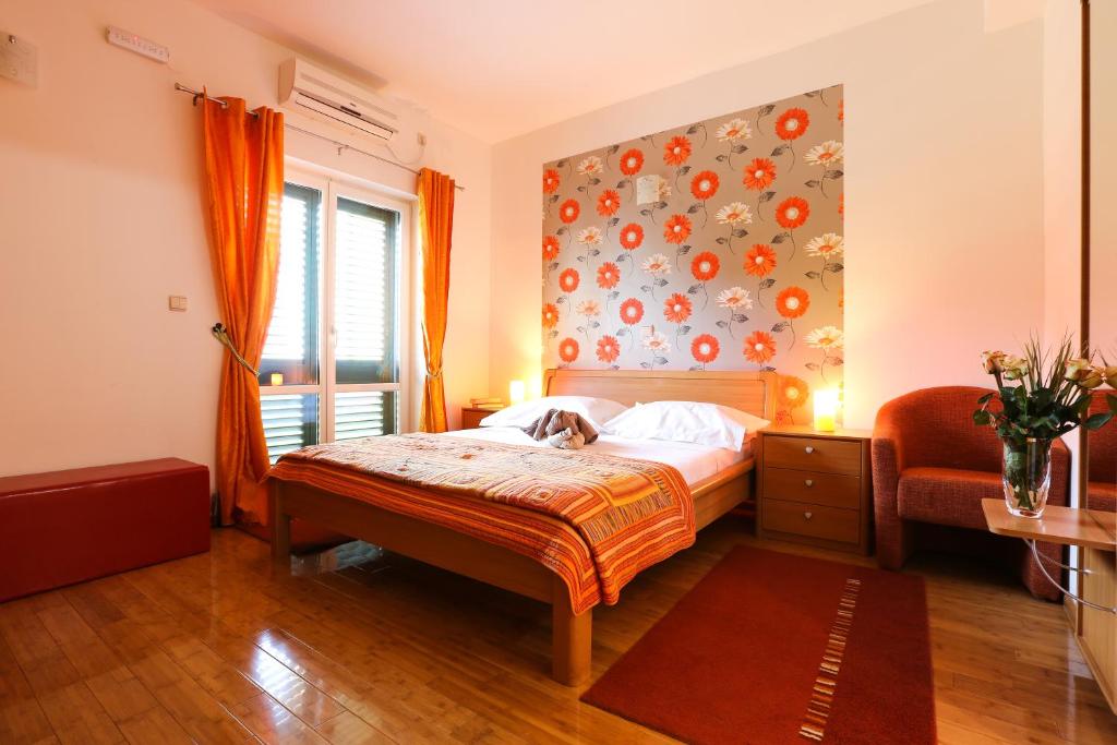 Postel nebo postele na pokoji v ubytování Sunrise Apartments 3