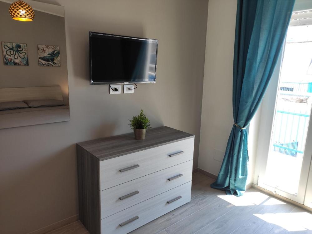 Telewizja i/lub zestaw kina domowego w obiekcie Antica Dogana Apartments