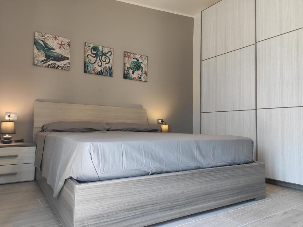 Łóżko lub łóżka w pokoju w obiekcie Antica Dogana Apartments