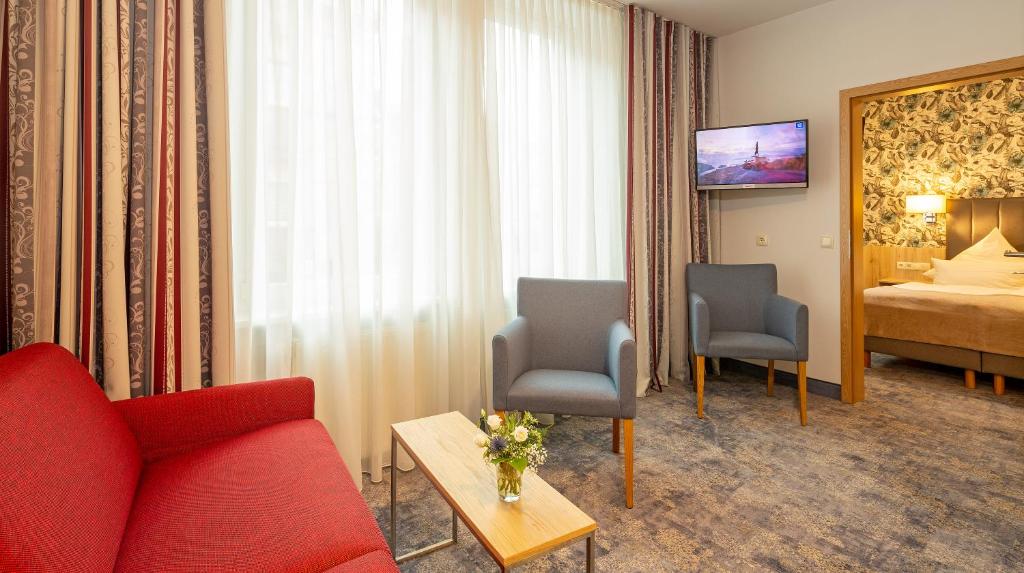 Postel nebo postele na pokoji v ubytování Hotel Löwengarten