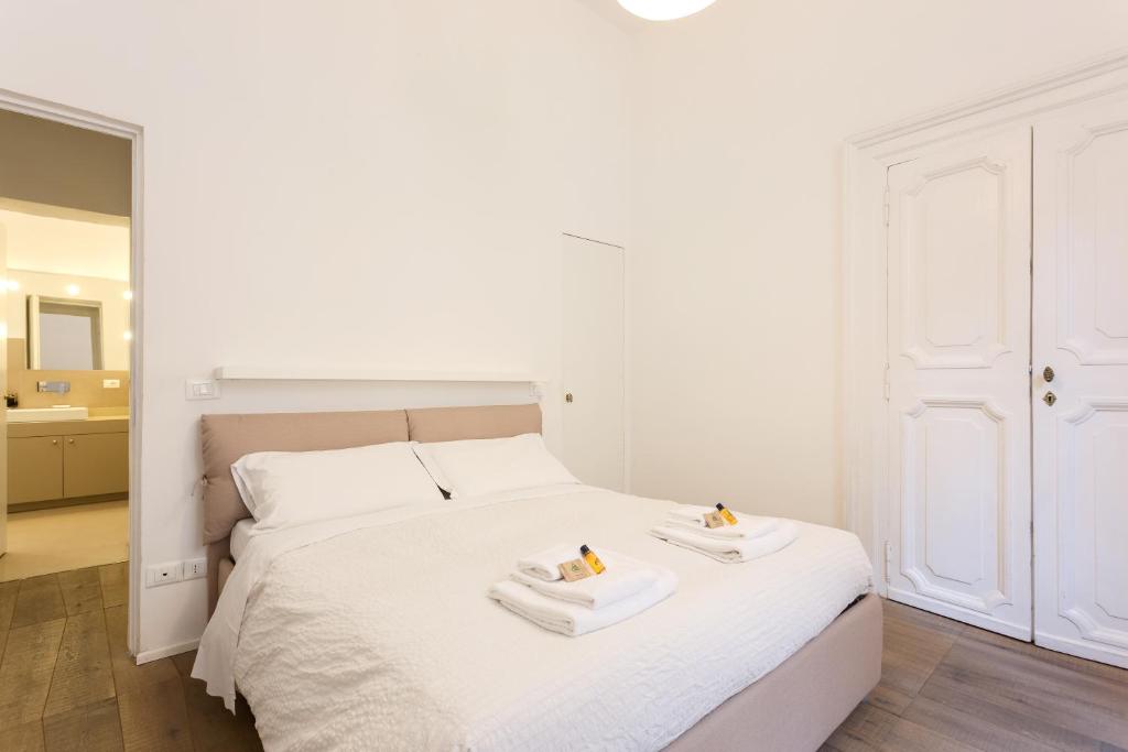 Posteľ alebo postele v izbe v ubytovaní Rome As You Feel - Fontanella Borghese Luxury Apartment