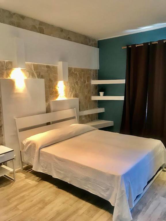 Postel nebo postele na pokoji v ubytování B&B Villa Dunardi