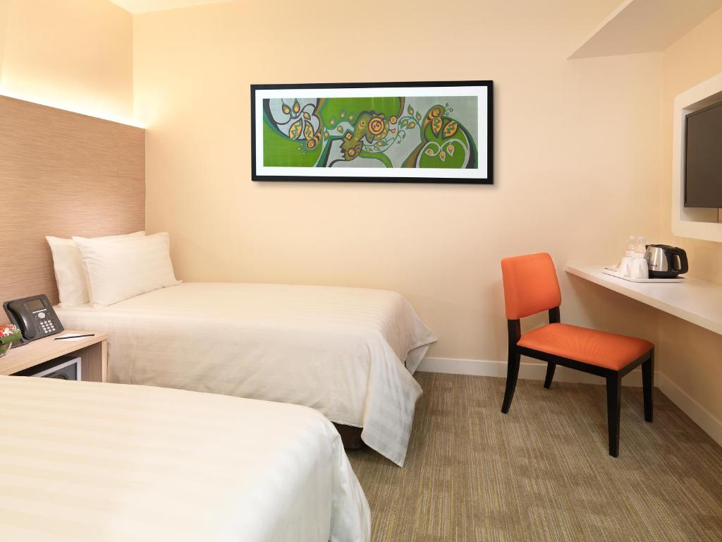 Postel nebo postele na pokoji v ubytování Sama-Sama Express KLIA Terminal 2 - Airside Transit Hotel