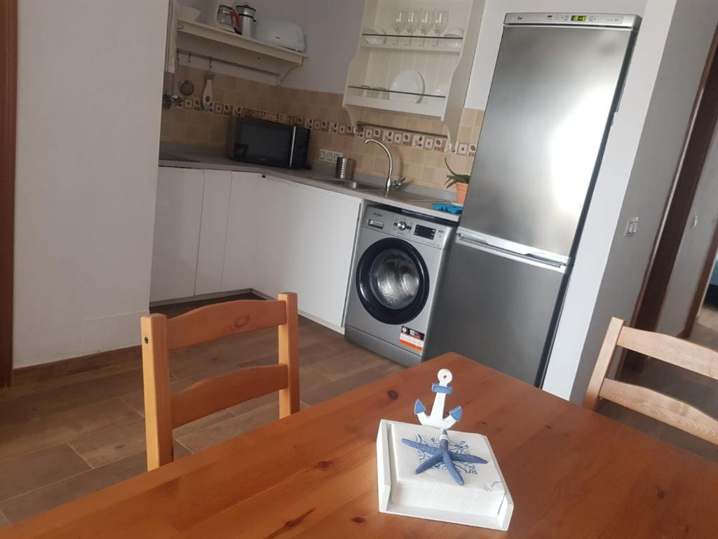 Kuchyň nebo kuchyňský kout v ubytování Apartamentos Cotillo Family