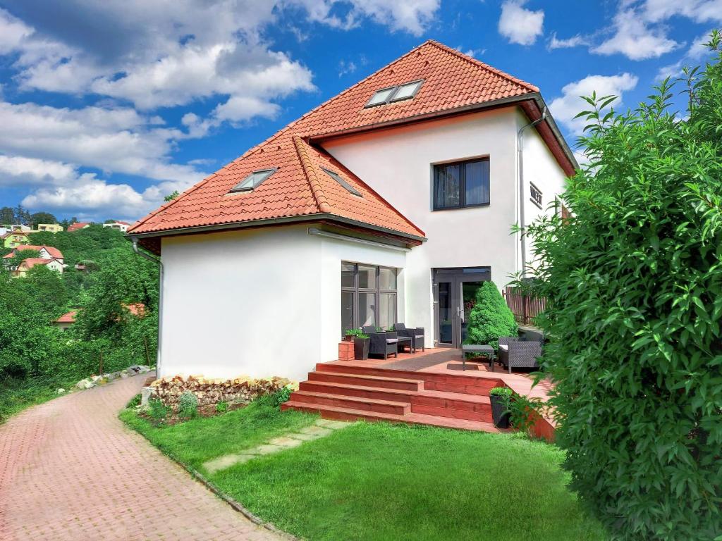 a white house with a red roof at Vincent in Luhačovice