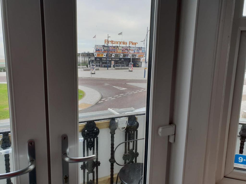 an open window with a view of a building at Henrys on the Prom in Great Yarmouth