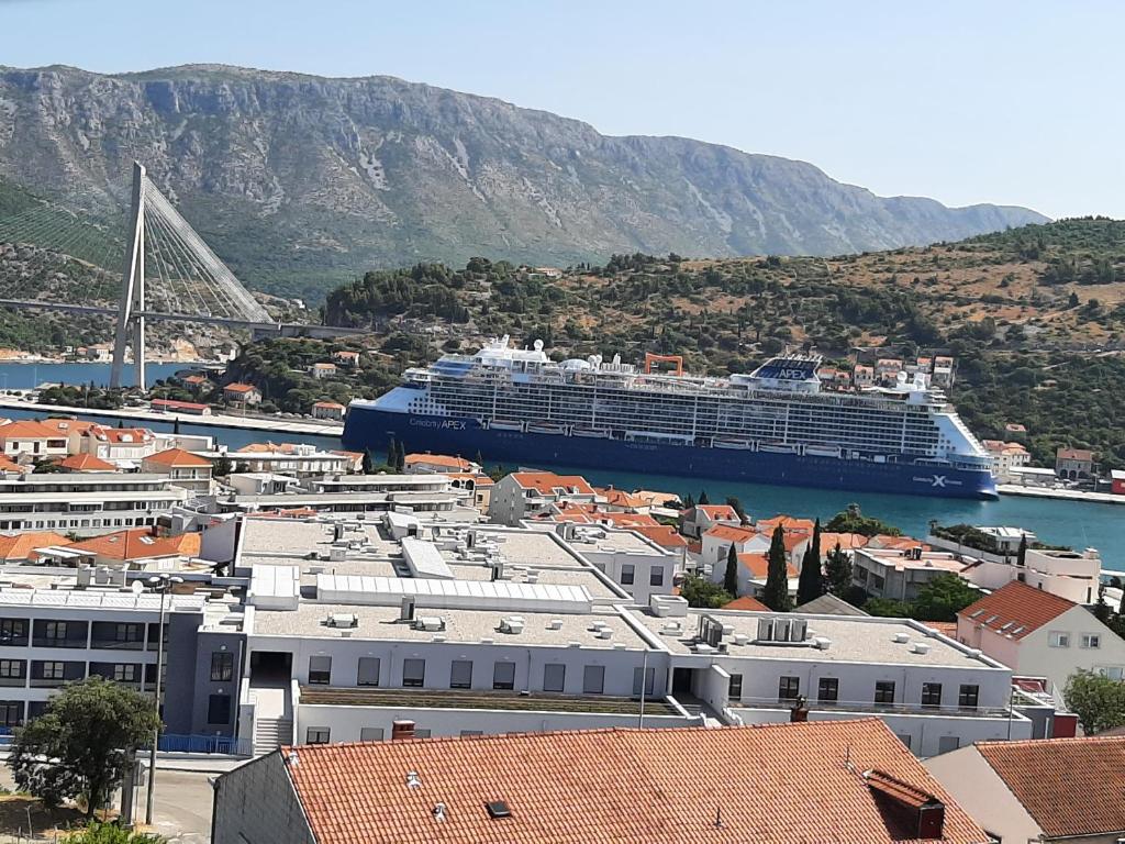 a cruise ship is docked in a harbor at Dubrovnik Apartment Nepe in Dubrovnik