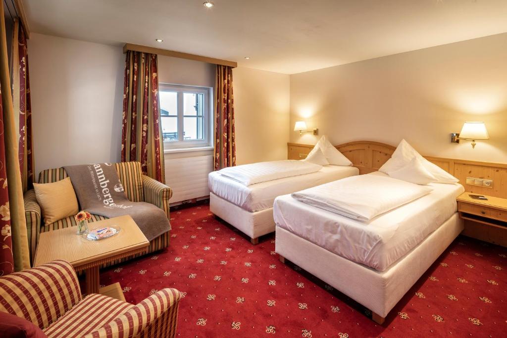 Postel nebo postele na pokoji v ubytování Hotel Tannbergerhof im Zentrum von Lech