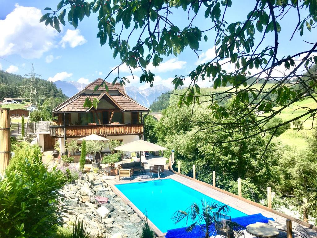 a villa with a swimming pool in a resort at Villa Evy in Mutters