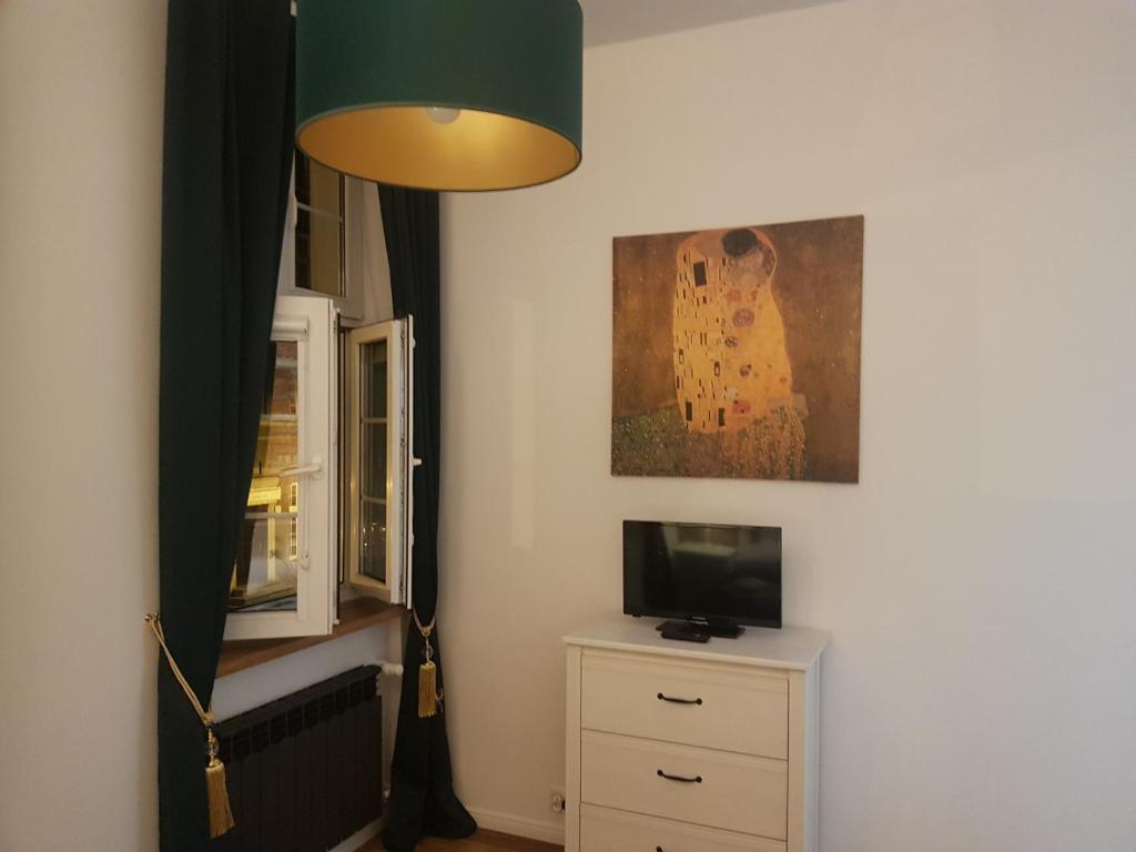 Televízia a/alebo spoločenská miestnosť v ubytovaní H&T Old Town Ogarna 97