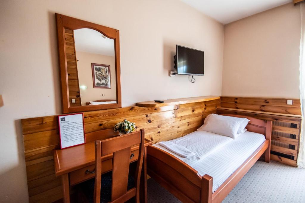 Postel nebo postele na pokoji v ubytování Hotel Enigma