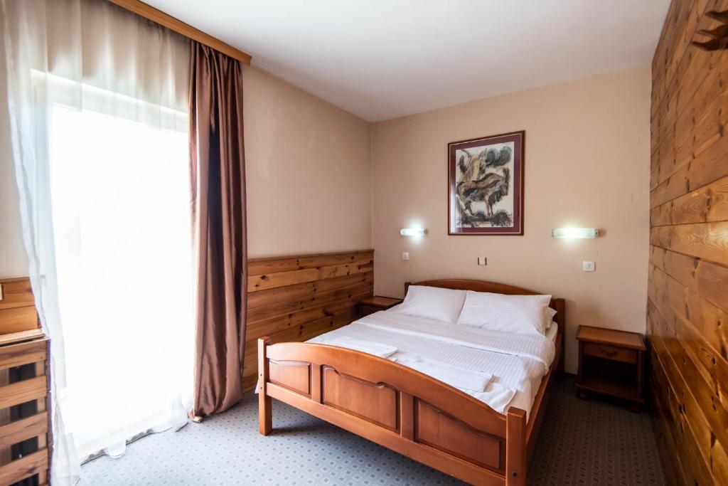 Postel nebo postele na pokoji v ubytování Hotel Enigma