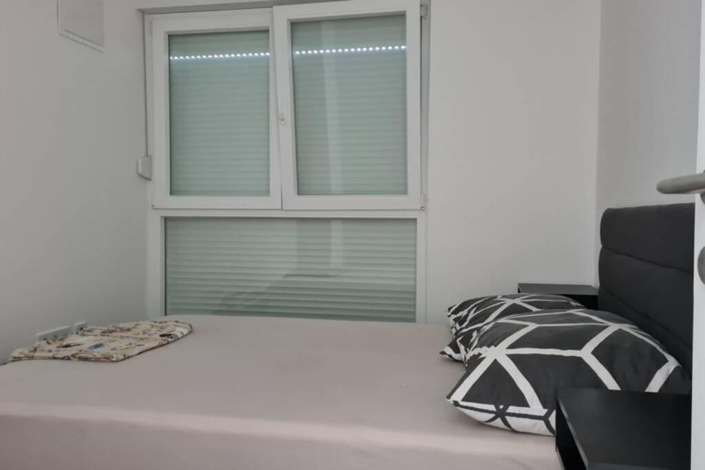 Łóżko lub łóżka w pokoju w obiekcie Mansion Duje