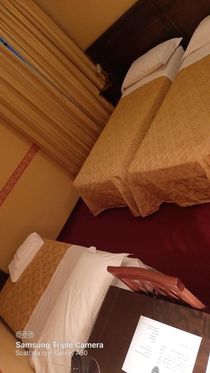 Postel nebo postele na pokoji v ubytování Hotel Damian Park Hotel Delle Magnolie