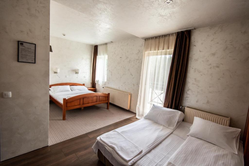 Postel nebo postele na pokoji v ubytování Hotel Enigma