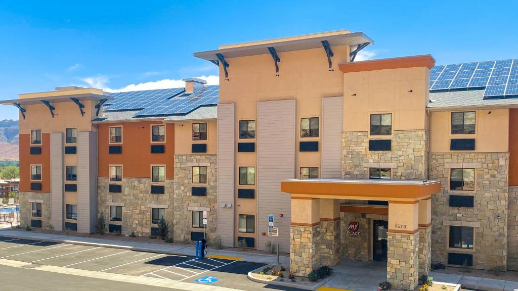 an apartment building with solar panels on it at My Place Hotel-Moab, UT in Moab