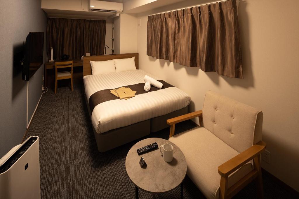 Coruscant Hotel NagasakiekiⅢ tesisinde bir odada yatak veya yataklar