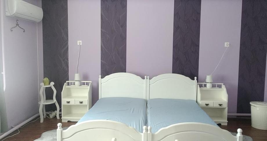 Postel nebo postele na pokoji v ubytování Dancz Home