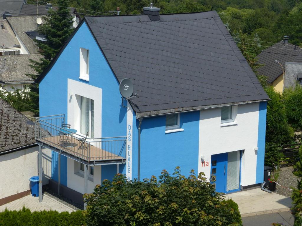 a blue and white house with a black roof at Das Blaue Haus in Boppard