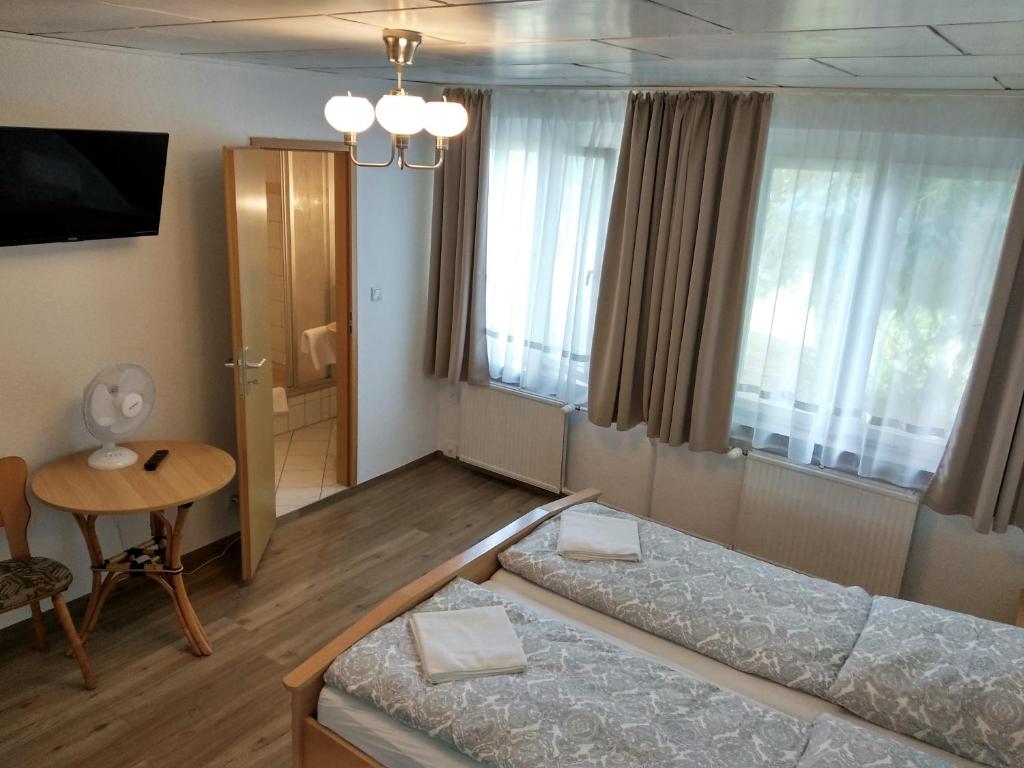 Voodi või voodid majutusasutuse Gasthof Uttewalde toas