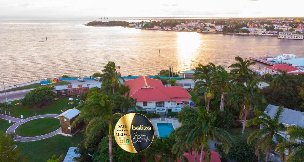 an aerial view of a resort near the water at Harbour View Boutique Hotel & Yoga Retreat in Belize City