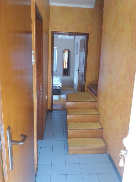 a hallway with stairs leading to a room at Apartman Mila i Kaja in Nikšić
