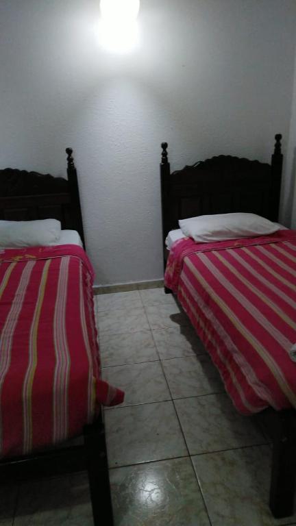 Una cama o camas en una habitación de Hotel Atlântico Avenida