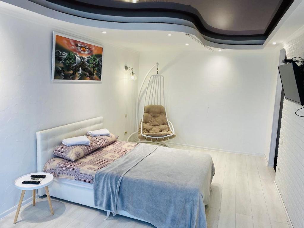 Ένα ή περισσότερα κρεβάτια σε δωμάτιο στο Apartments on Polytech
