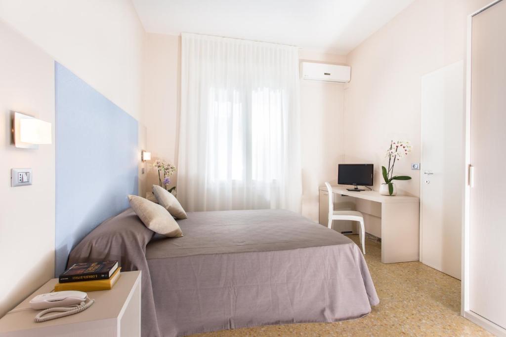 Postel nebo postele na pokoji v ubytování New Hotel Chiari