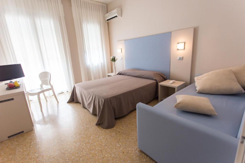 Postel nebo postele na pokoji v ubytování New Hotel Chiari