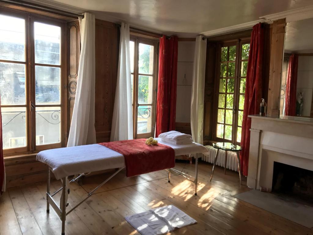 En eller flere senge i et værelse på Maison d'hôtes de Charme